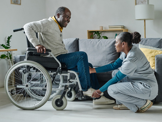 A caregiver providing personal care support to a client at home