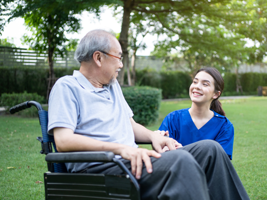 A caregiver providing respite care support to a client at home